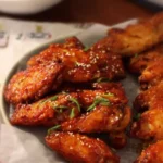 Delicious Korean baked wings with a crispy golden exterior and savory glaze.