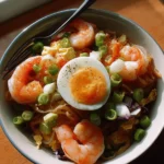 Delicious shrimp egg roll in a bowl served with fresh veggies and dipping sauce